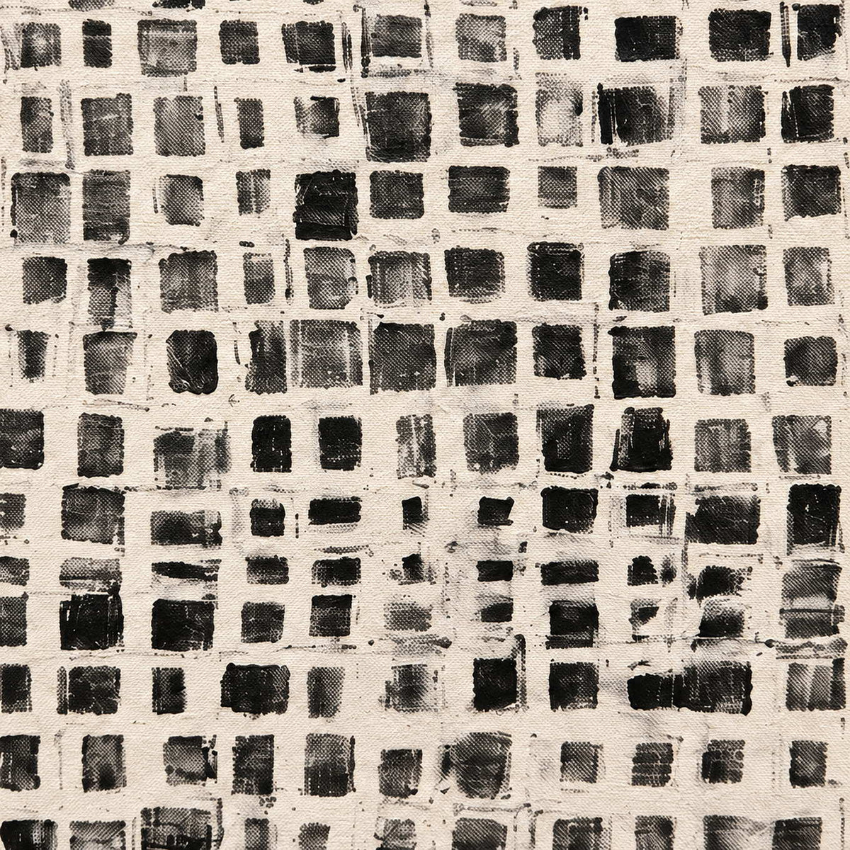 Close-up of uneven dark squares and overlapping cream grid lines.