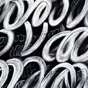 Close view of layered white looping brushstrokes and fine marks over black.