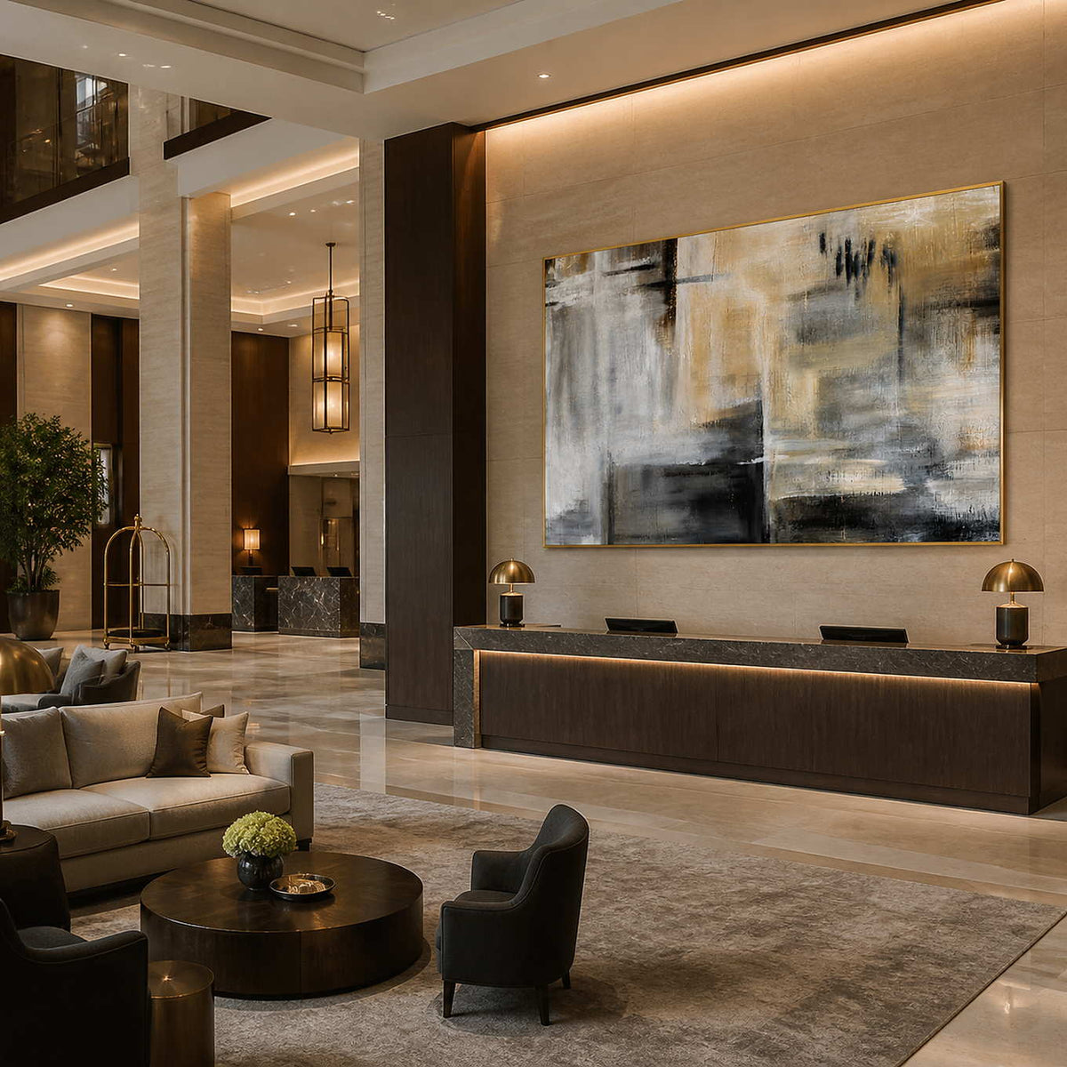 Gold framed horizontal abstract artwork above a hotel reception counter in a spacious lobby.