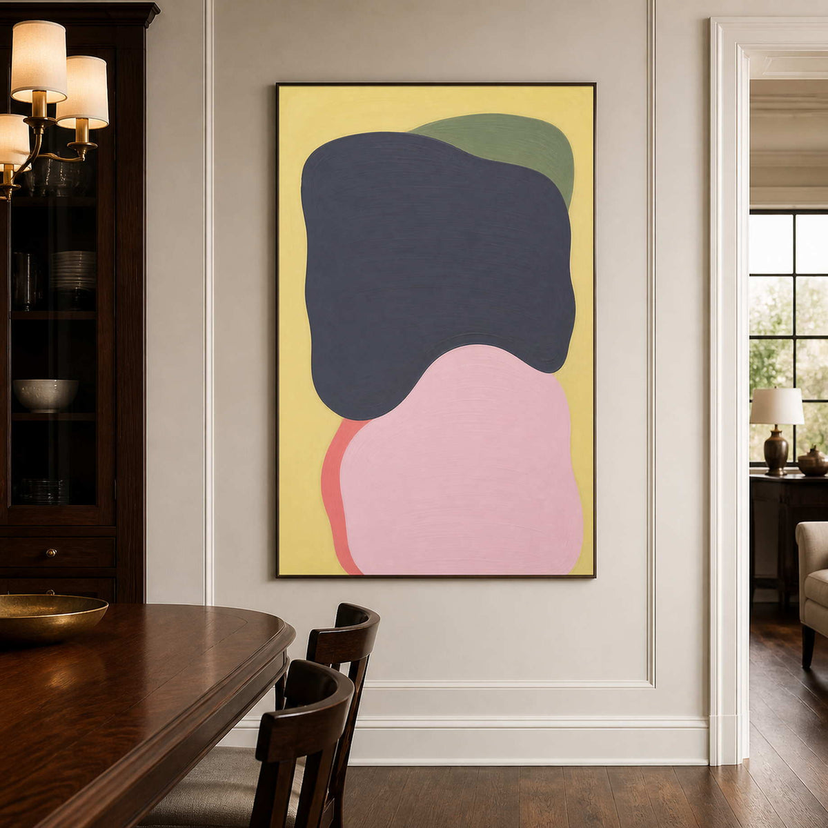 Charcoal and blush abstract canvas adds quiet color to a dining room.