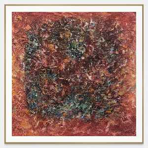 Front view of a dark textured ring surrounded by rust red and orange with scattered turquoise flecks, with a gold-colored frame.