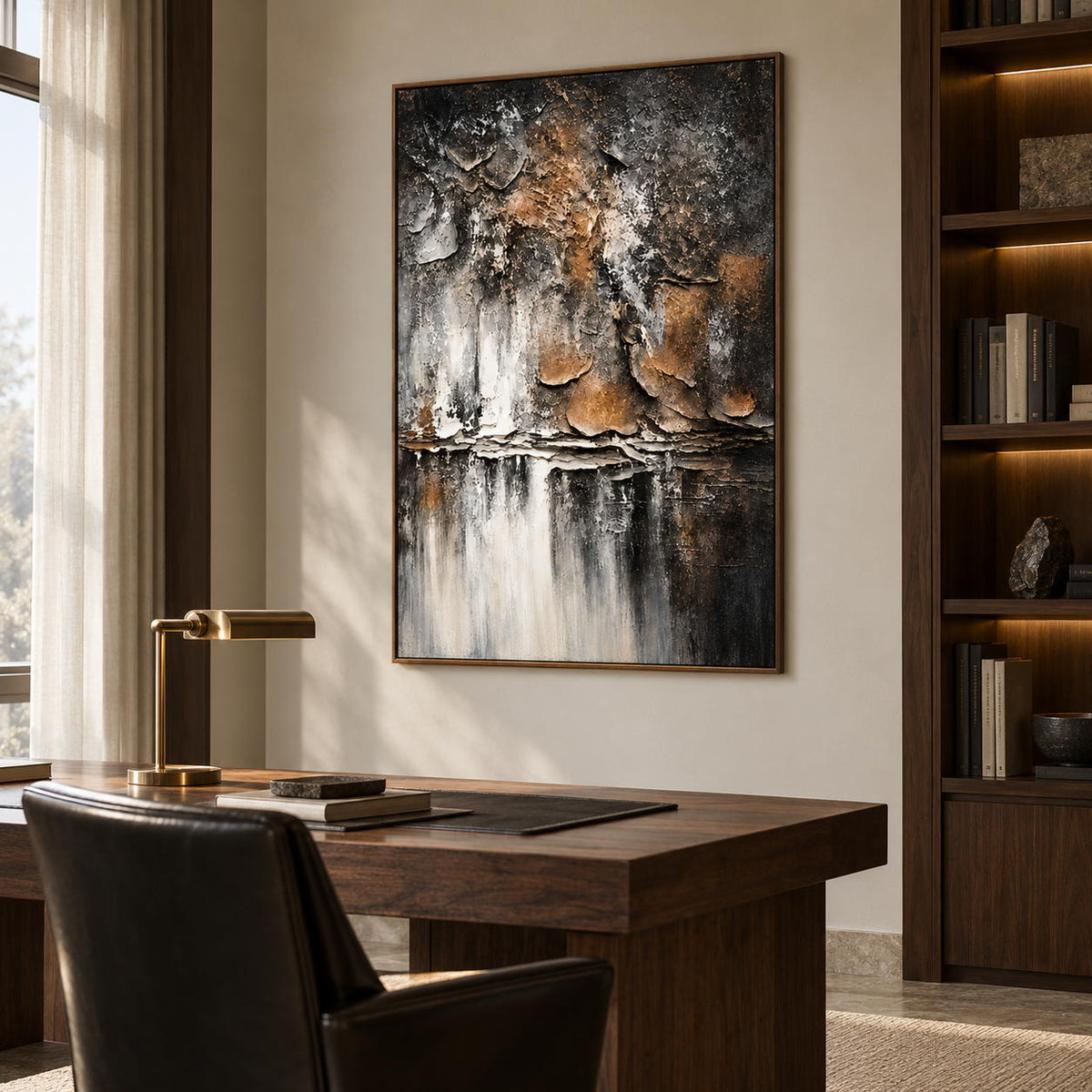 Artwork showing dark gray and brown flaking forms above horizontal strata and pale vertical streaks in a study with a desk, with a brown wood-look frame.