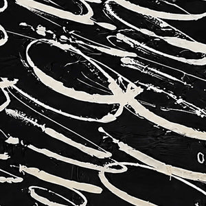 Close view of pale looping brushstrokes and thin trails across textured black paint.
