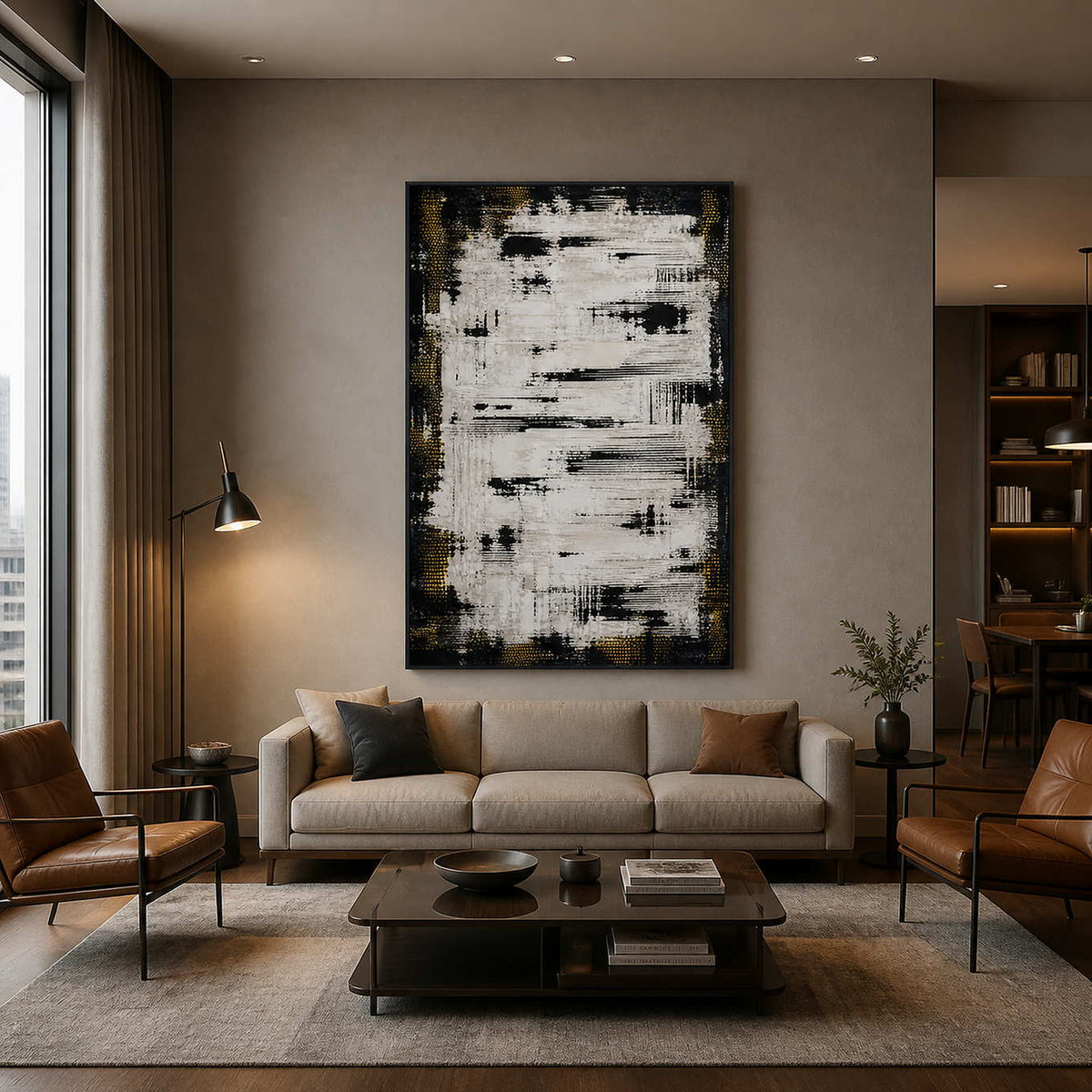 Notes in White in a black frame above a neutral sofa, with layered white marks standing out against a black ground.