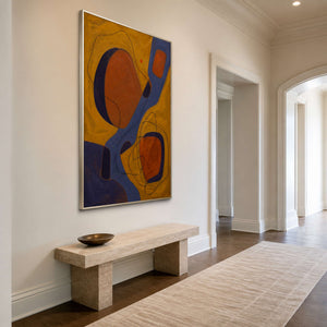 Vertical abstract artwork adding rich color to a bright entryway.