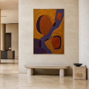 Vertical textured abstract canvas bringing color to a quiet hotel lobby.