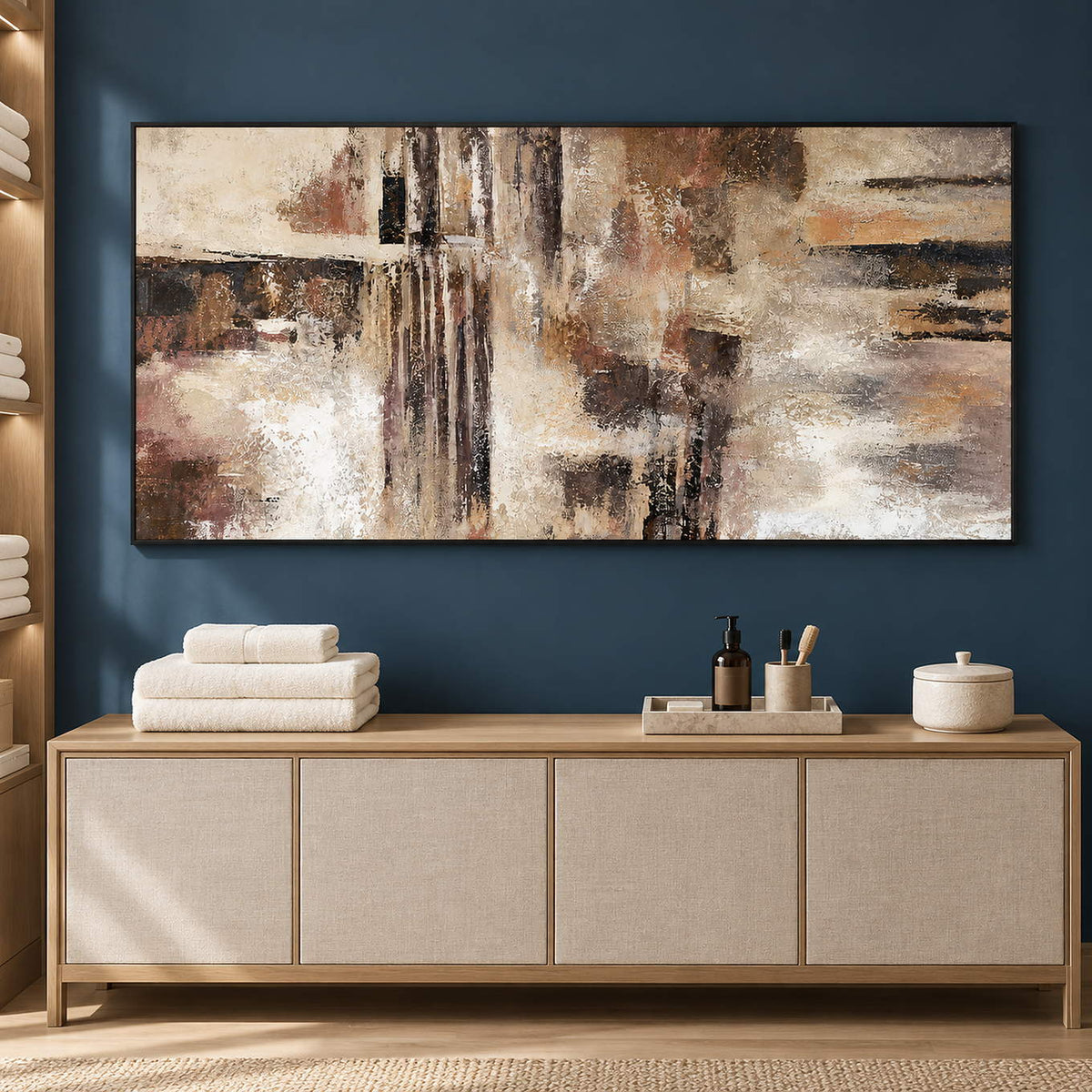 Hand-painted abstract wall art in ivory, taupe, umber, and charcoal, displayed in a bathroom dry area in a black frame.