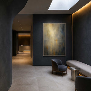 Serene coastal wall art in a dark spa hotel waiting area.