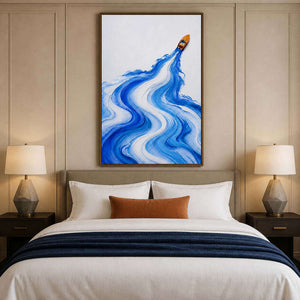 Vertical blue coastal wall art styled above a modern bed.