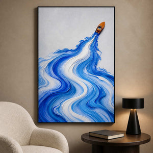 Cobalt wake painting styled beside a quiet modern reading chair.