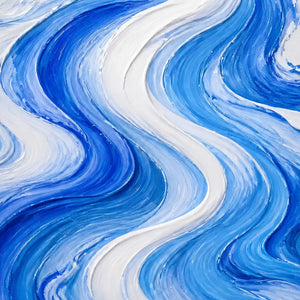 Close-up of layered cobalt, sky blue, and white wake texture.