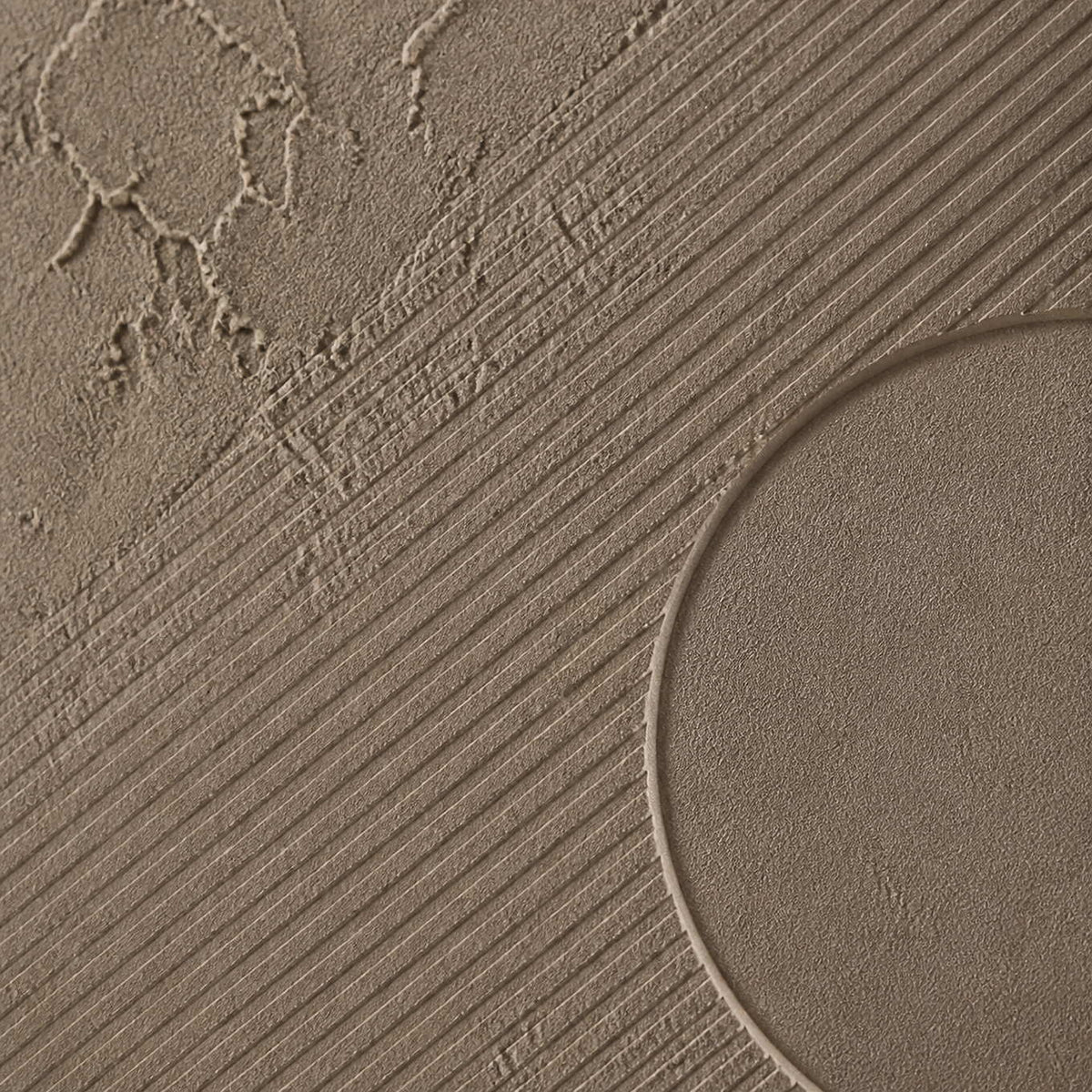 Close-up of diagonal grooves meeting a rounded plaster relief.
