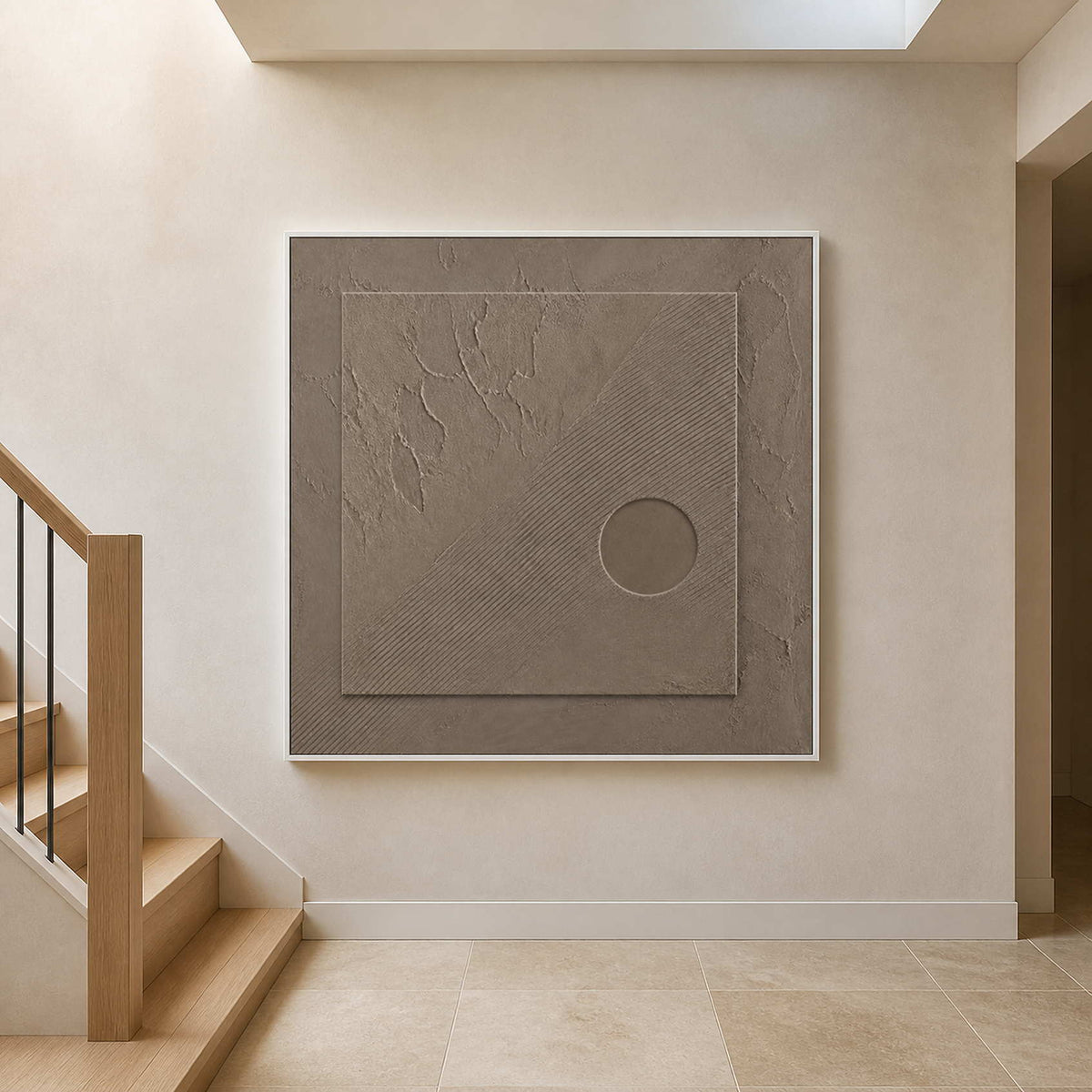 Minimalist taupe artwork displayed above a warm limestone stair landing.