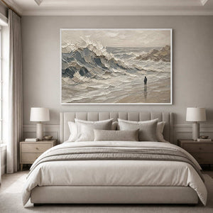 Calming gray coastal wall art above a serene bedroom with a white frame.