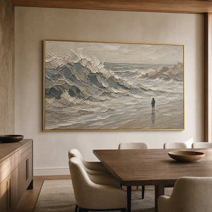 Atmospheric ocean wall art in a warm dining room with a gold frame.