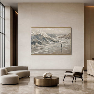 Large coastal wall art with sweeping waves in a modern hotel lobby.