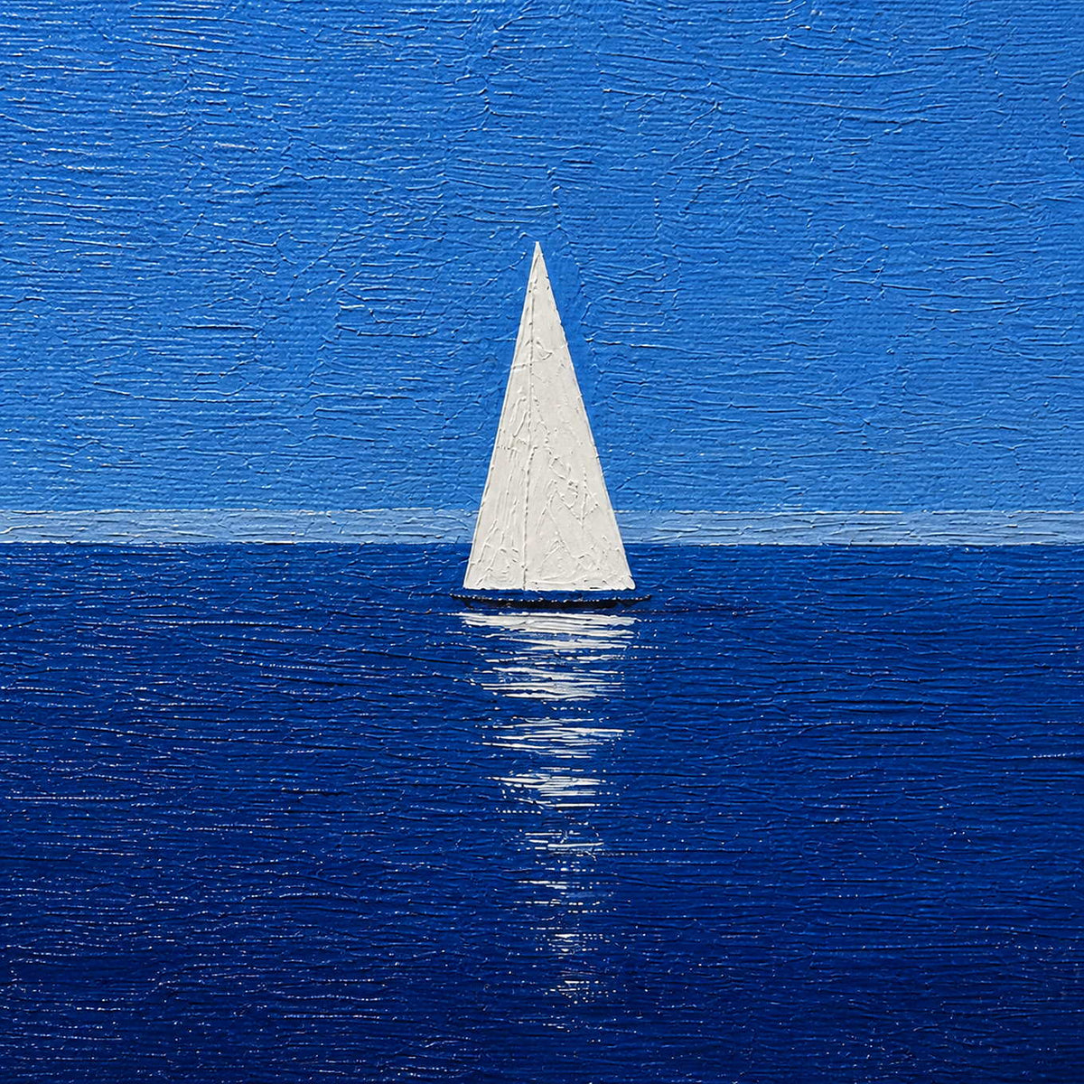Close-up of raised blue texture and a white painted sailboat.