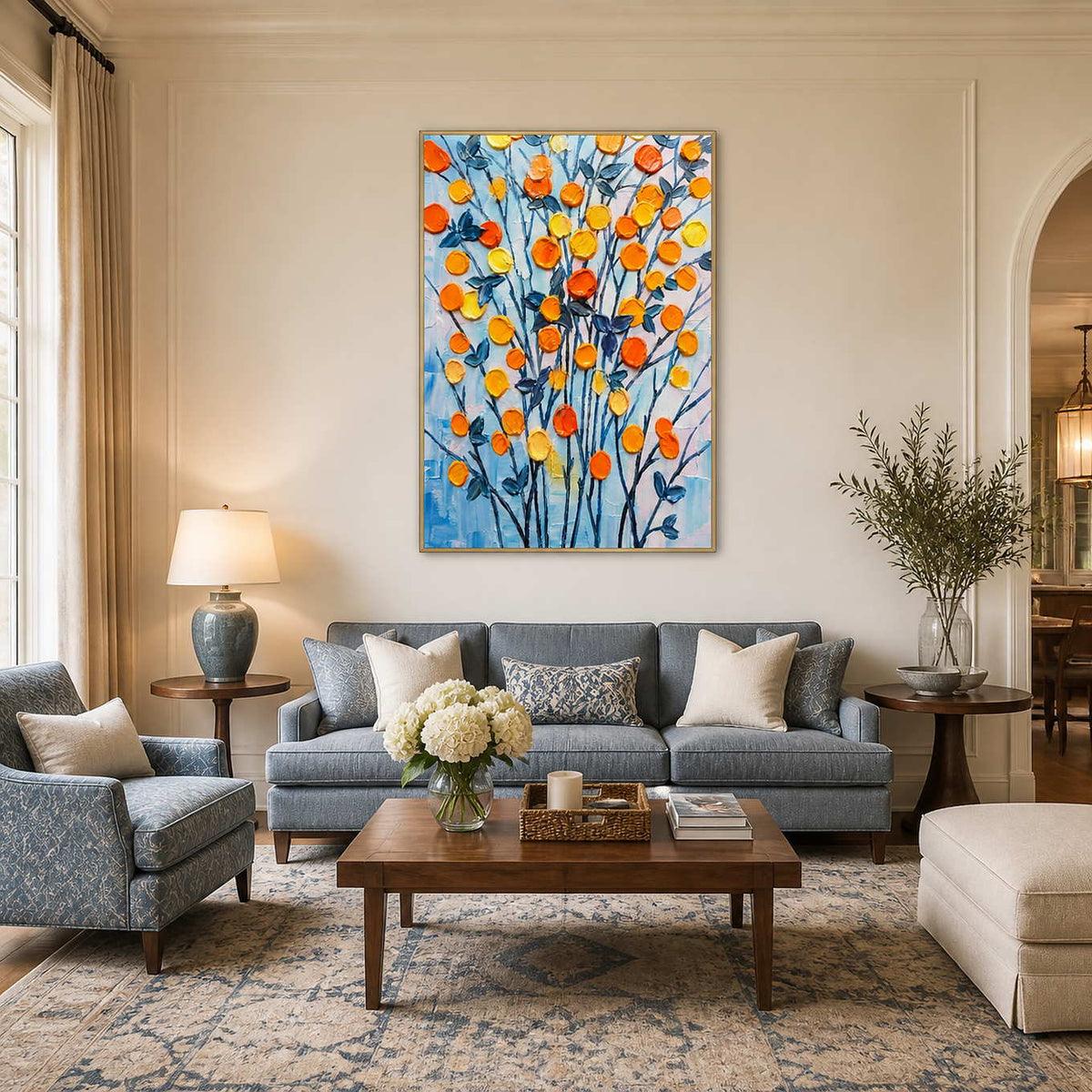 Textured orange floral wall art displayed in a bright living room.