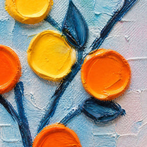 Close-up of raised orange petals and navy stems on blue.