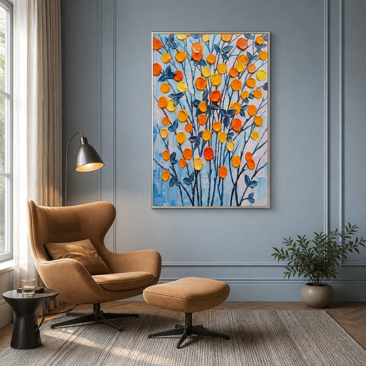 Colorful bloom painting displayed beside a caramel reading chair.
