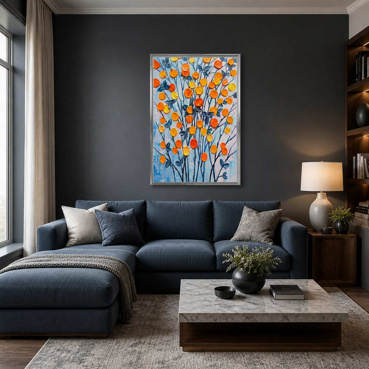 Colorful botanical artwork displayed above a navy modern living room sofa.