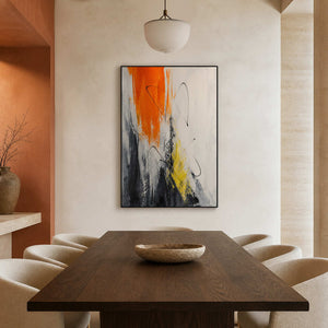 Bold orange abstract painting displayed in a warm dining room.