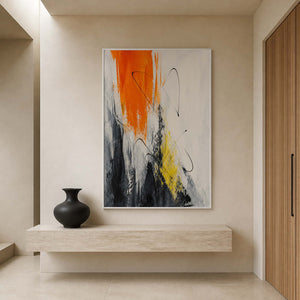 Vertical textured artwork displayed above a cream stone entryway console.