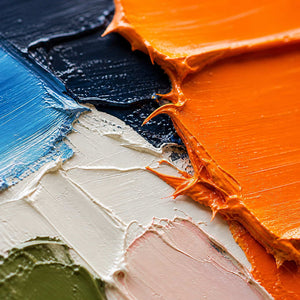Close-up of thick orange, navy, ivory, and olive palette-knife texture.