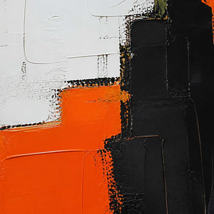 Close-up of raised orange, ivory, and black geometric palette-knife blocks.