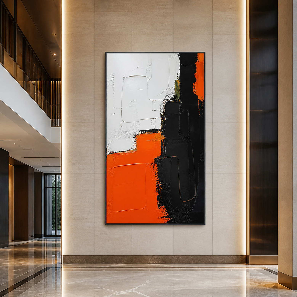 Bold orange and black abstract painting displayed in a contemporary hotel lobby.