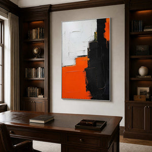Modern block-form painting creates a bold focal point in a dark office.