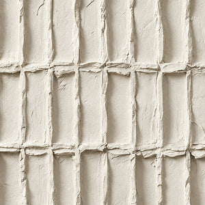 Close-up of uneven ivory rectangle borders and soft recessed shadows.