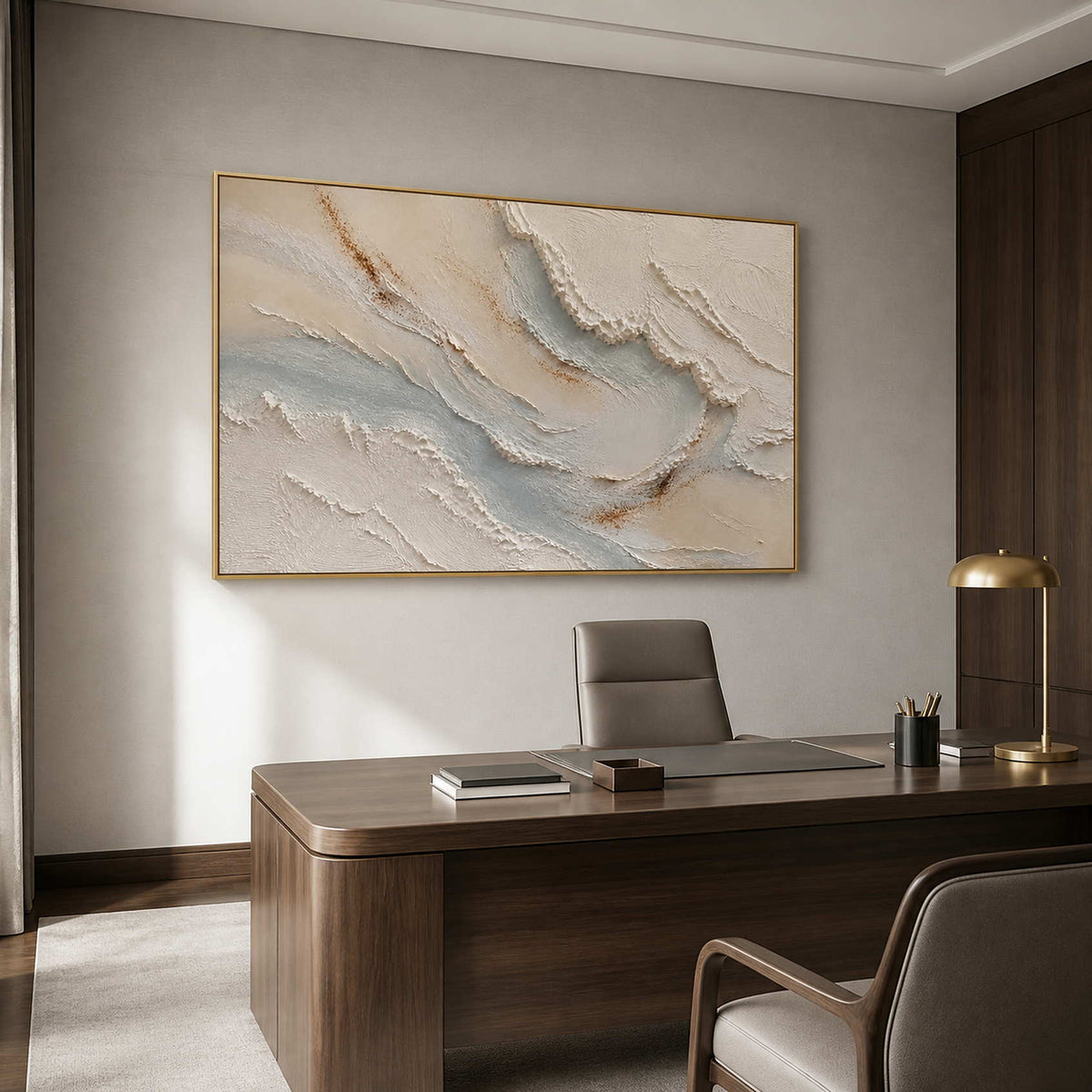 Pale textured coastal wall art in a modern office with a gold frame.