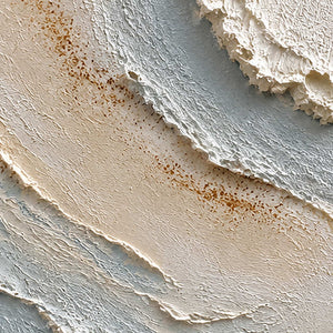 Close-up of raised ivory, misty blue, and warm-brown hand-painted texture.