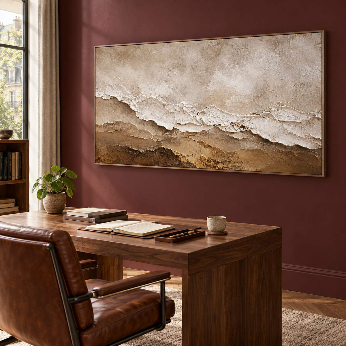 Hand-painted ivory, beige, and brown textured abstract canvas, displayed in a study in a brown wood frame.