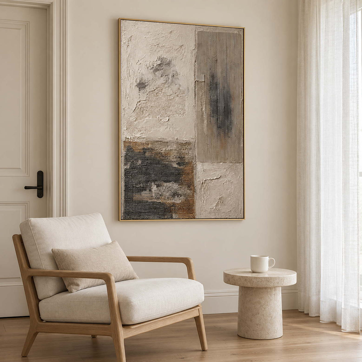 Weathered ivory and beige textures with gray blocks and dark marks in a gold frame, displayed beside seating in a lounge.
