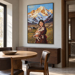 Artwork showing a person holding a sheep before grazing sheep and pale blue, white and ochre mountains in a dining area beside the table, with a black frame.