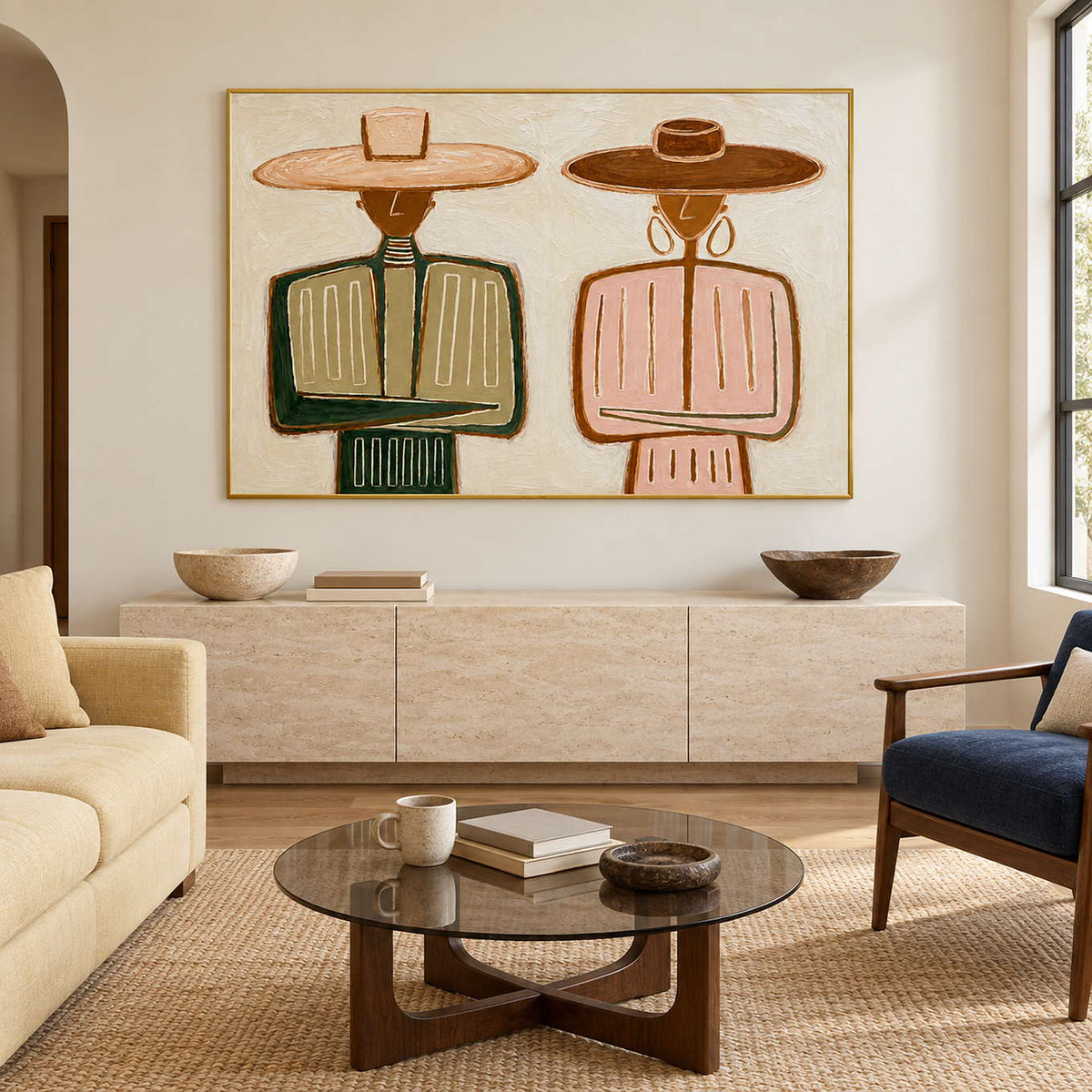 Paired-figure painting above a pale cabinet behind a glass coffee table.
