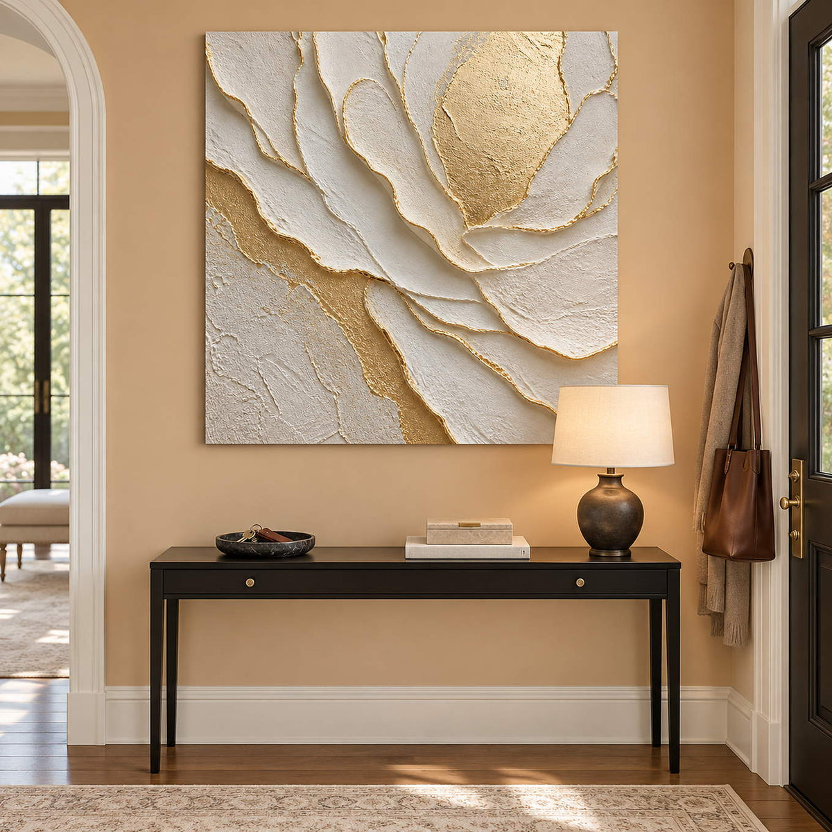 Hand-painted sculptural flower in layered ivory, white, and warm gold, displayed in an entrance hall without an outer frame.