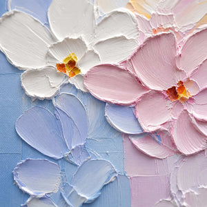 Close-up of raised hand-painted texture in blue, pink & blush, and white.