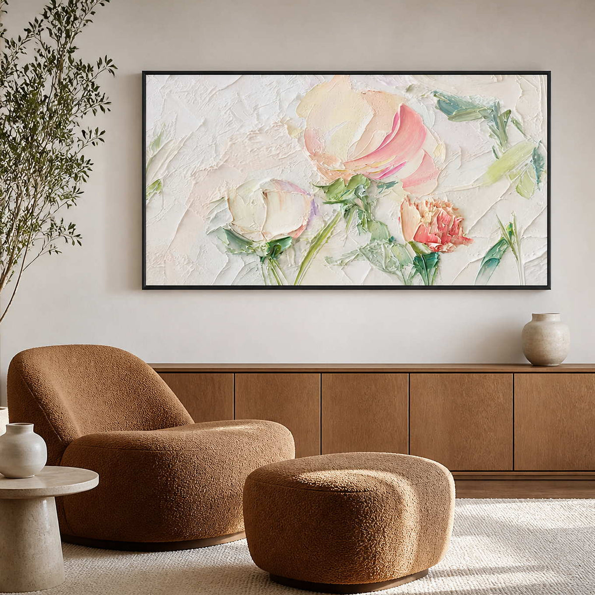 Black framed floral painting above a brown reading chair and matching ottoman.