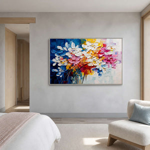 Colorful floral wall art displayed in a mist-blue guest bedroom lounge.