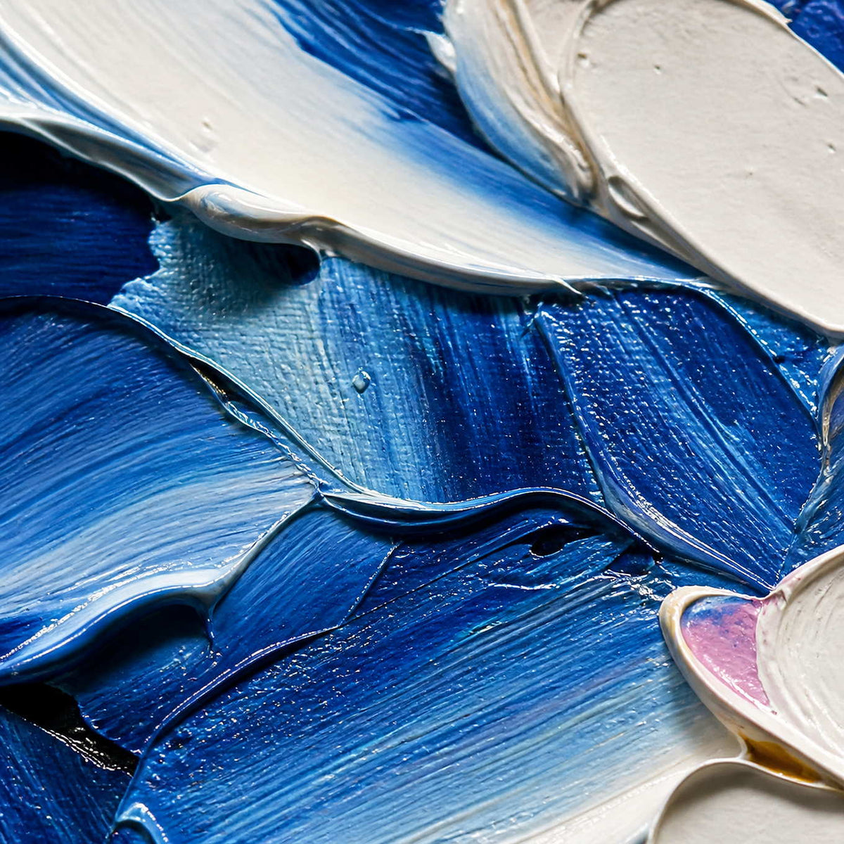 Close-up of cobalt blue petals meeting thick white floral impasto.