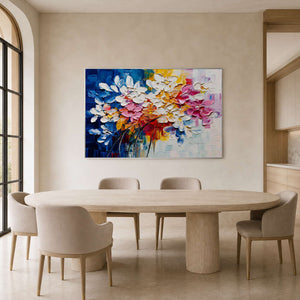 Textured floral branch artwork displayed in a warm ivory dining room.