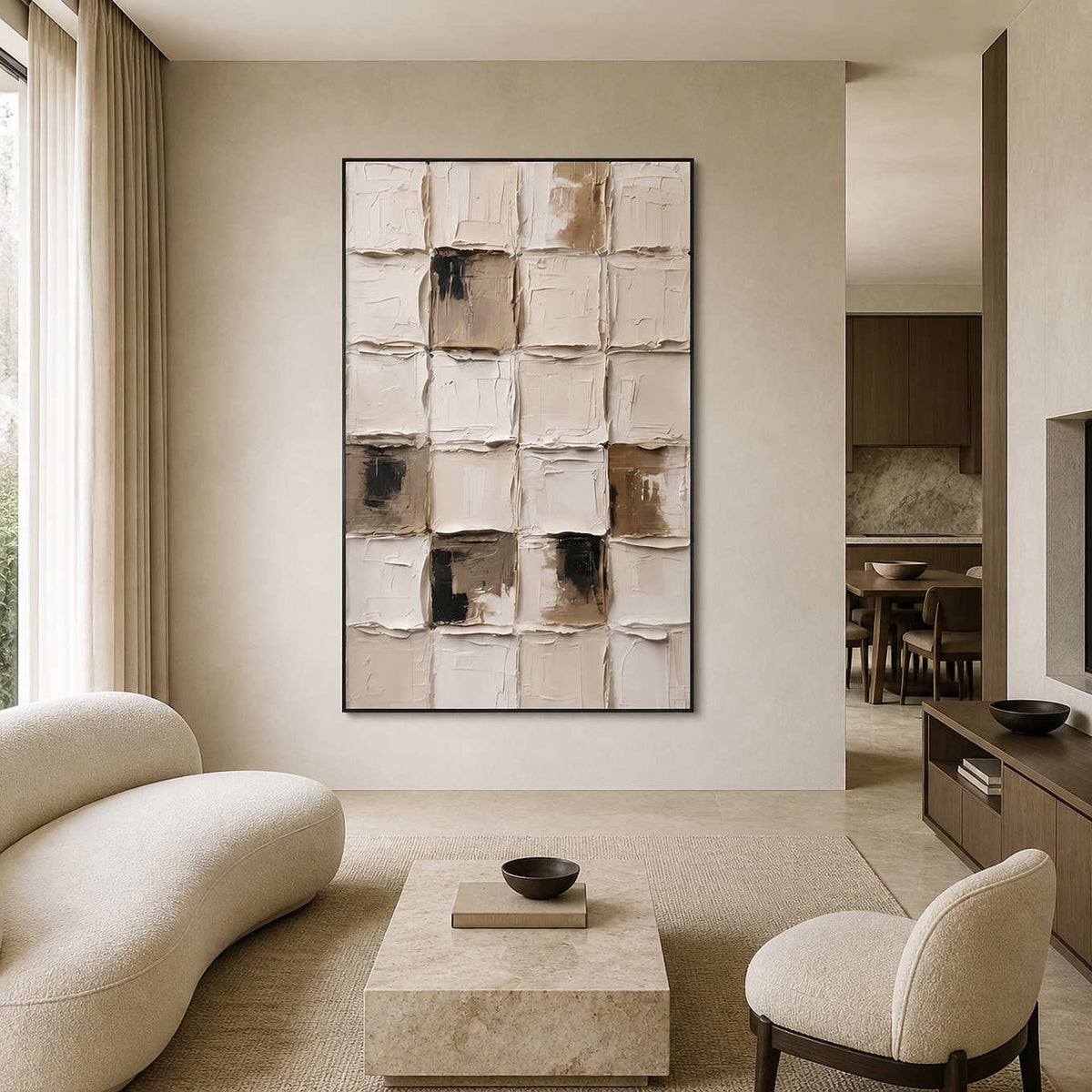 Cream textured grid painting in a black frame beside rounded living room seating.