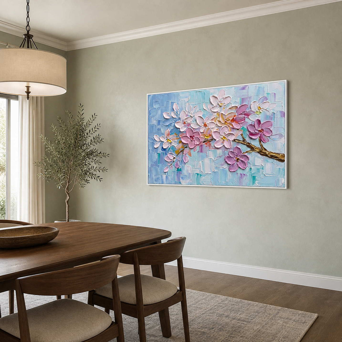 Pink botanical wall art displayed in a pale green dining room.