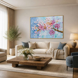 Textured pink floral wall art displayed in a warm modern living room.