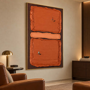 Orange tennis artwork in a sitting corner beside a brown chair and gold-toned lamp.