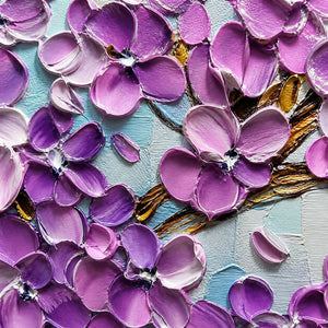 Close-up of sculpted violet petals and gold-brown branches.