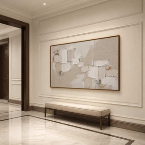 Horizontal textured wall art in a luxury entryway with a wood frame.